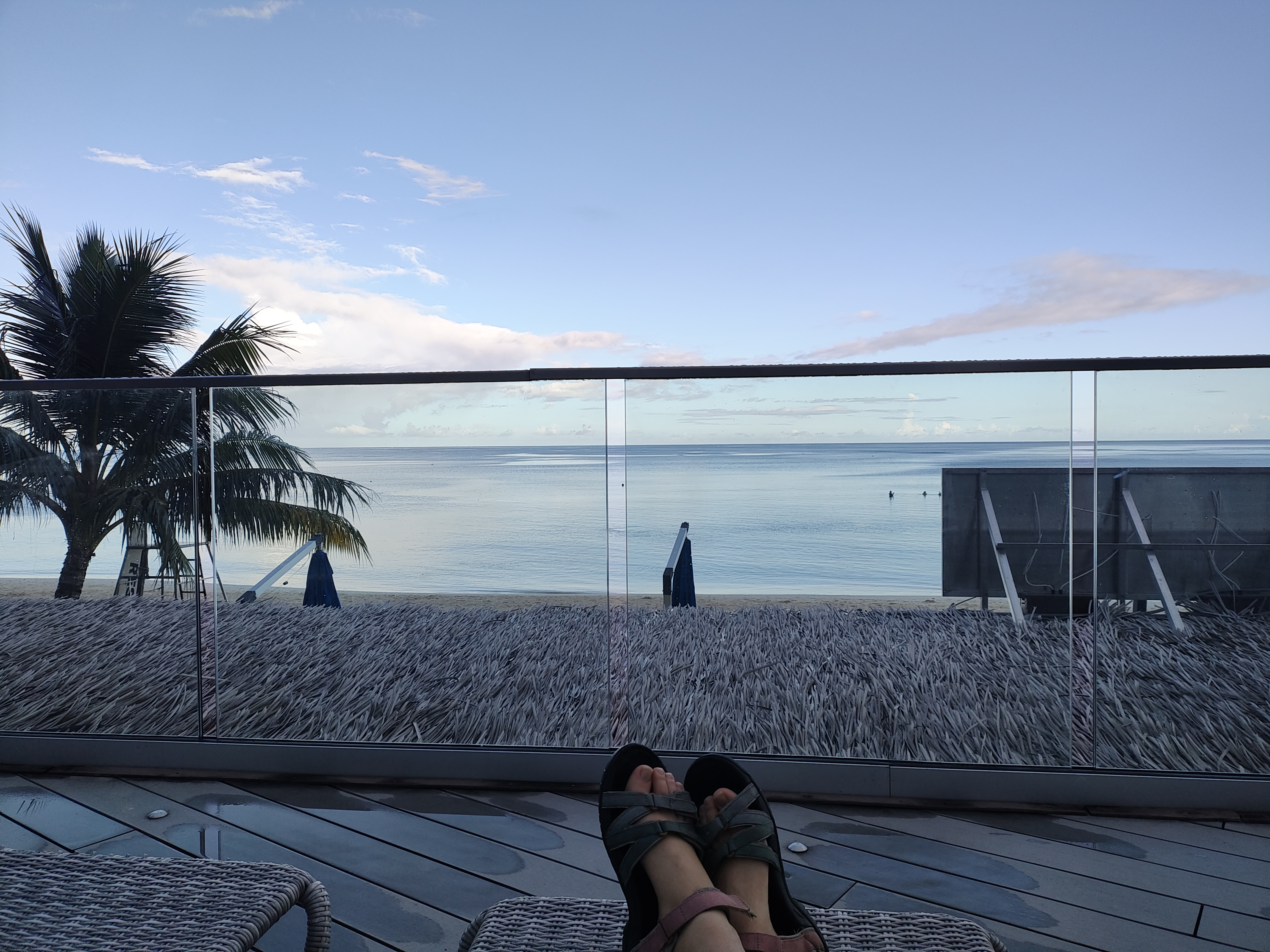 another view of the beach, this time from a pool chair on a deck. My sandal-clad toes are visible at the bottom of the picture