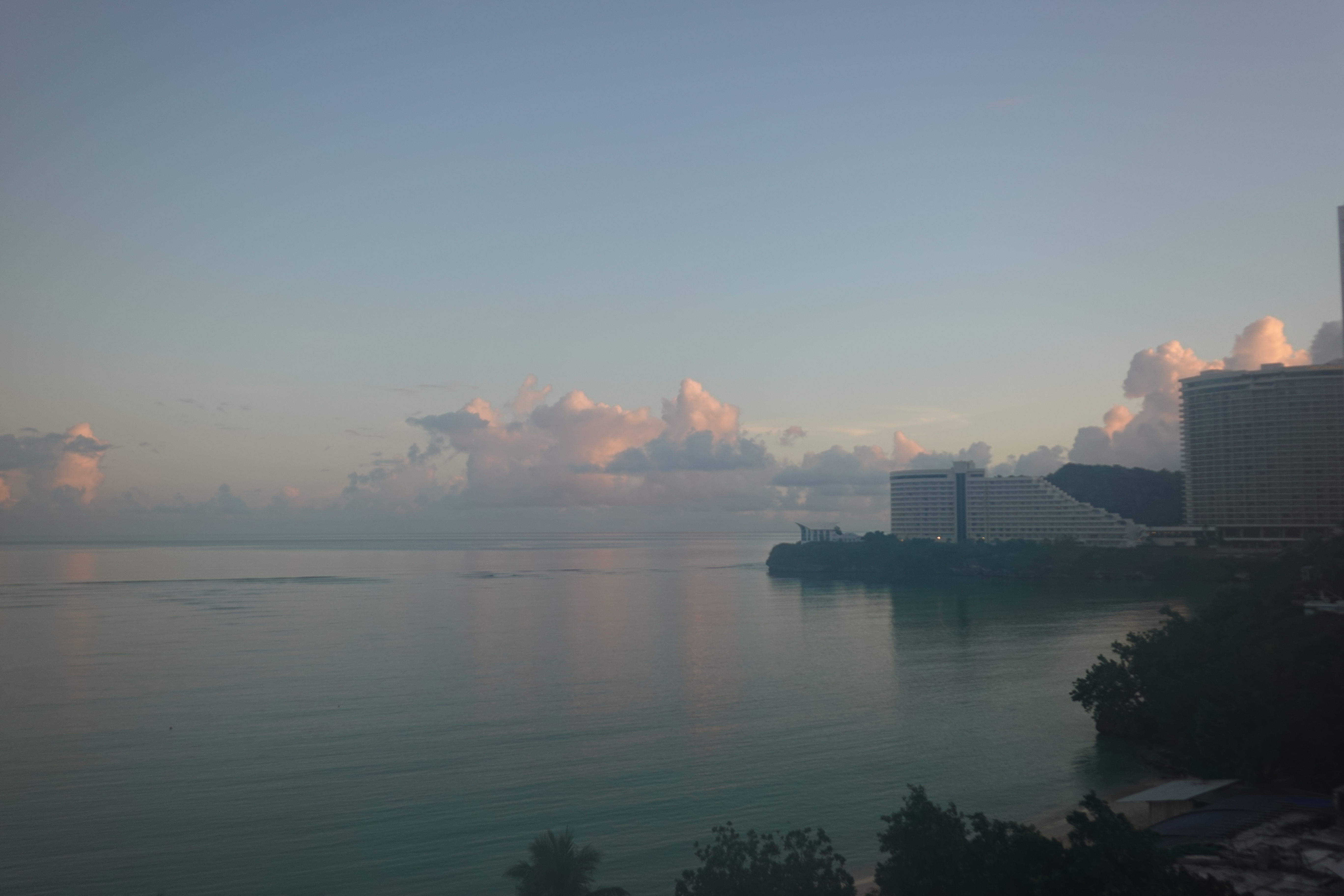landscape photo of a beach at sunrise. Same as the previous photo but a little lighter and with softer detail